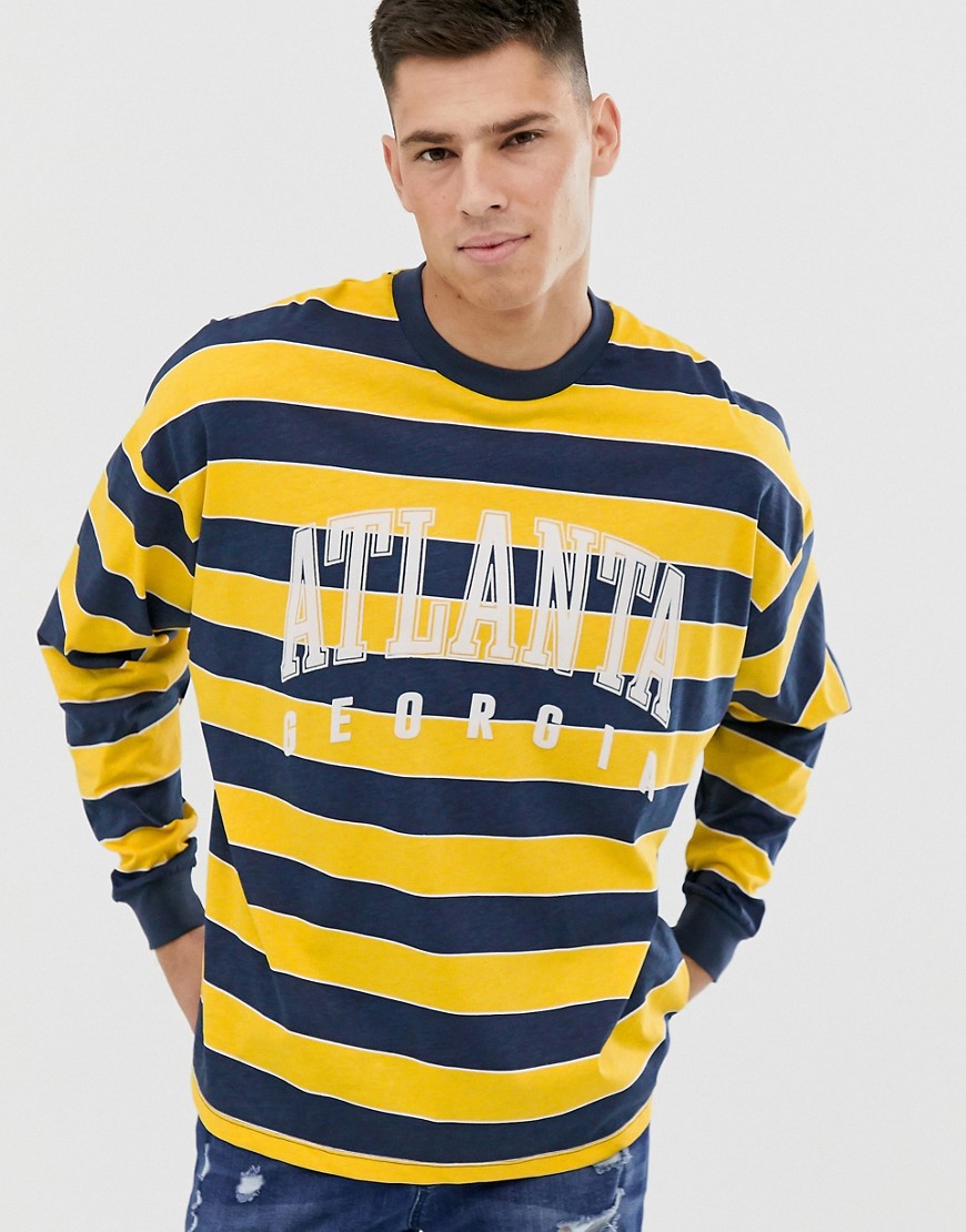 ASOS DESIGN – Randig t-shirt i oversize-modell med lång ärm och flockat stadstryck-Flerfärgad