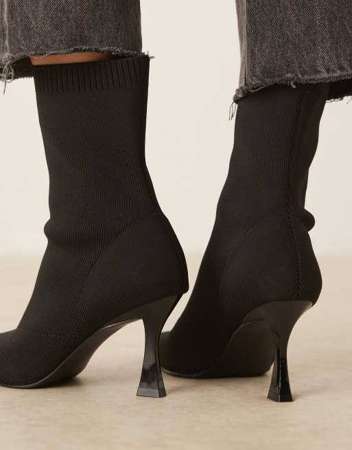 ASOS DESIGN Reagan chisel toe sock boots in black knit
