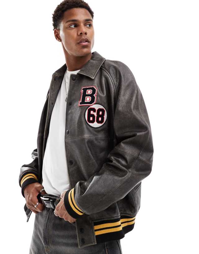 ASOS DESIGN - real leather bomber jacket with varsity badging in black wash