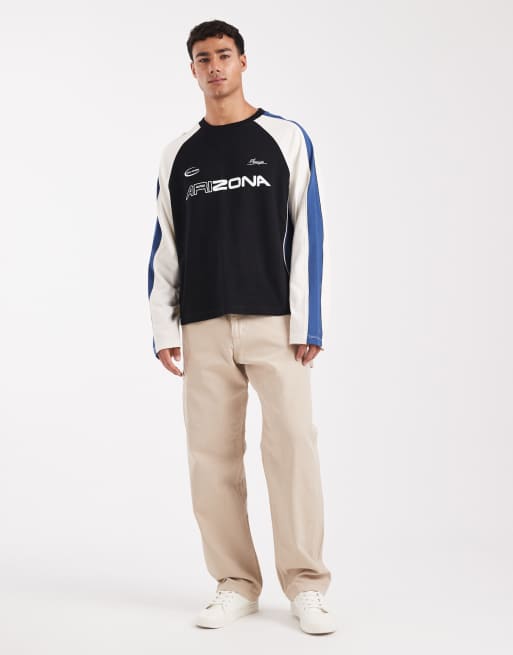 ASOS DESIGN boxy oversized long sleeve t-shirt with cut and sew panelling and sports graphics in black