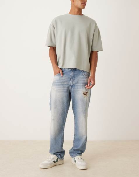 ASOS DESIGN - Rechte jeans met scheuren in middenblauwe wassing - view 1