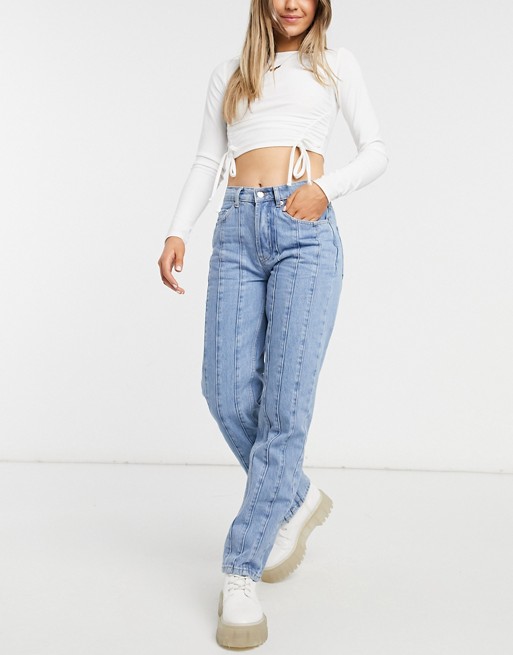 ASOS DESIGN mid rise straight leg jean with seams in midwash