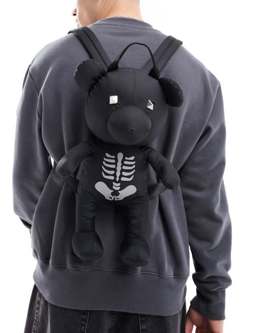 ASOS DESIGN – Reflektierender, Teddy-förmiger Rucksack in Schwarz mit Skelett-Print