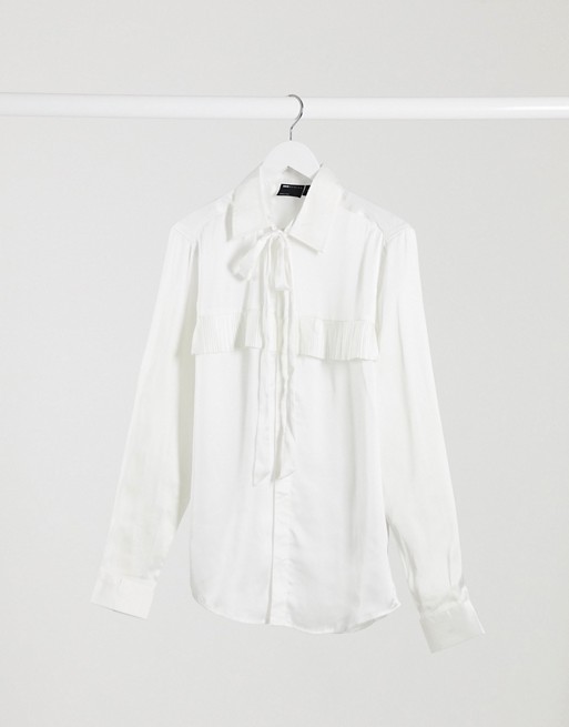 ASOS DESIGN regular fit satin shirt with ruffle yoke detail & tie front neck in cream