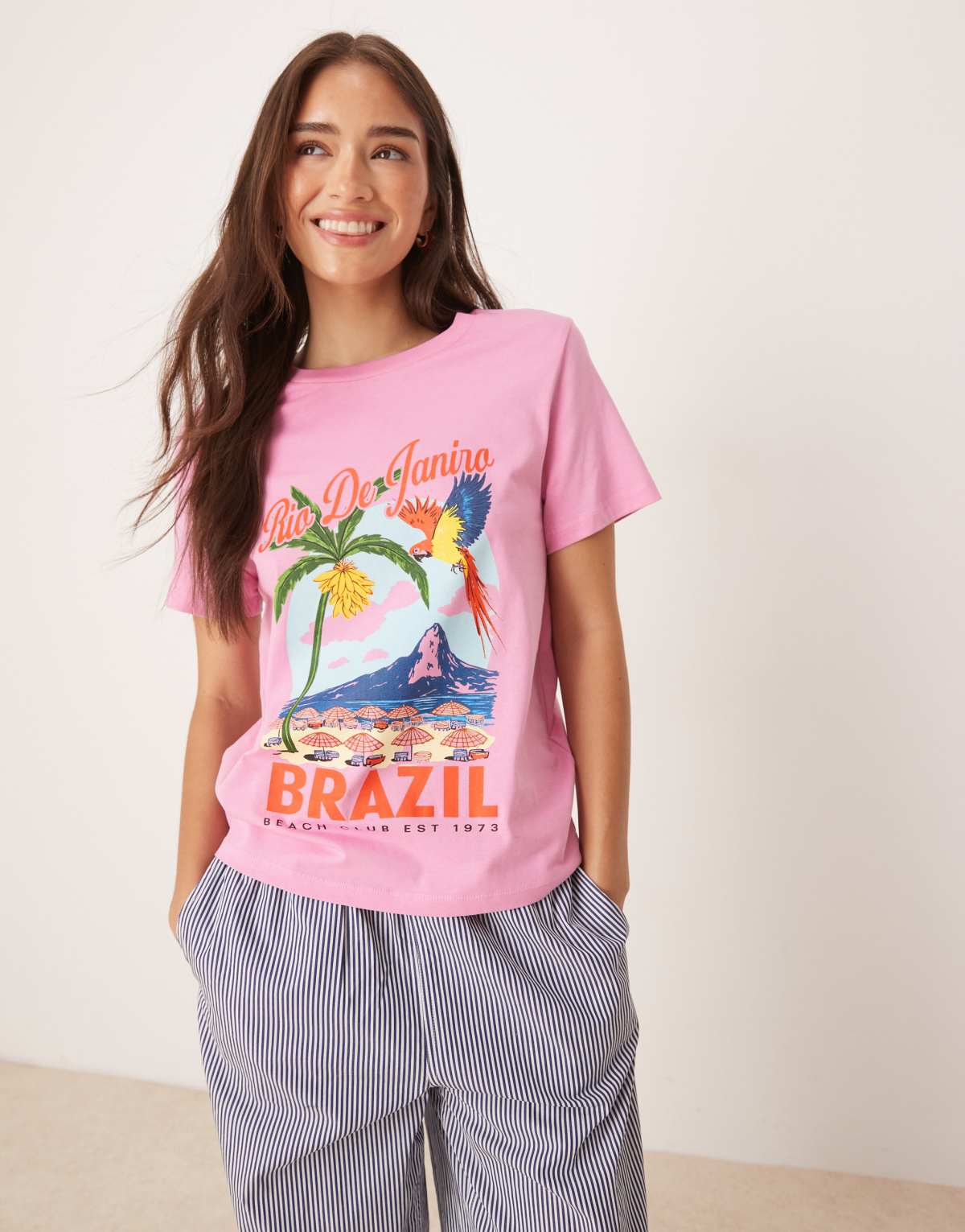 ASOS DESIGN regular fit t-shirt with brazil beach graphic in pink