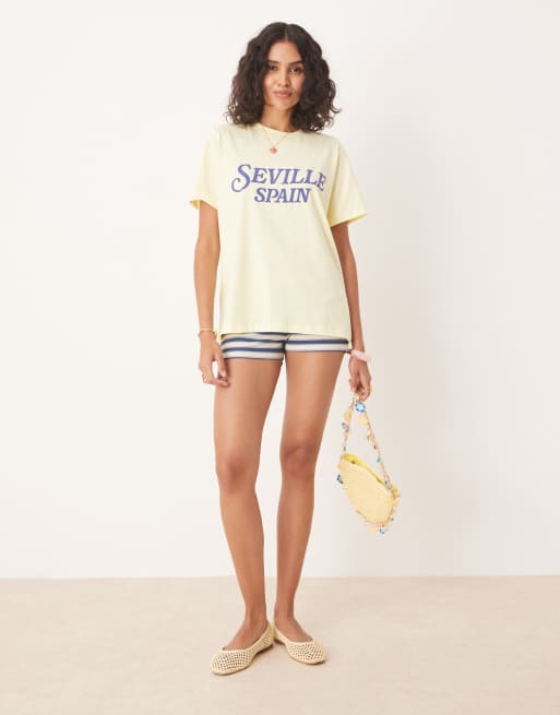 ASOS DESIGN regular fit t-shirt with Seville Spain graphic in yellow, 2 of 4