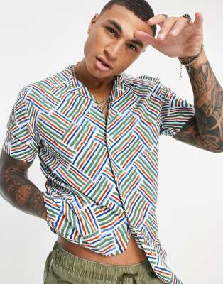 ASOS DESIGN regular revere aztec paintstroke print shirt in green