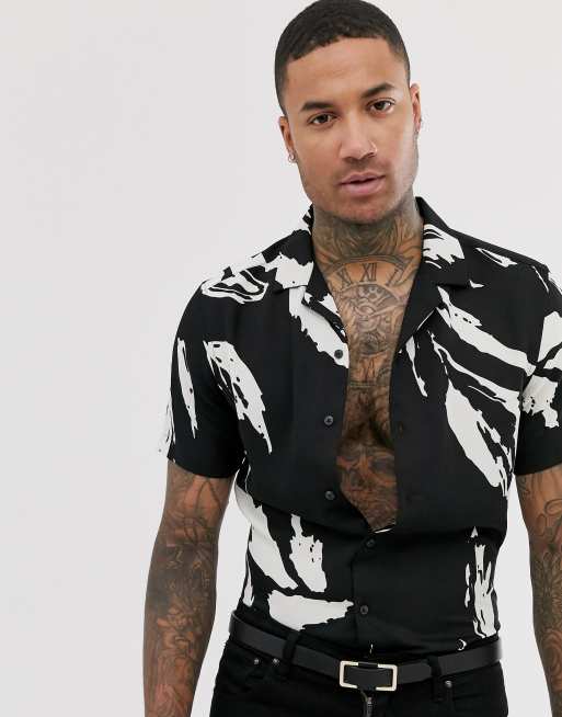 ASOS DESIGN regular revere fit abstract leaf print shirt in black