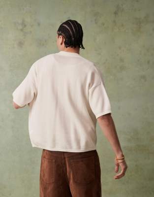 ASOS DESIGN RELAXED KNITTED BUTTON THROUGH POLO WITH FLORAL EMBROIDERY