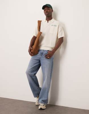 Asos Design Relaxed Boxy Fit Knitted Polo With Chest Pocket And Embroidery Text In Neutral