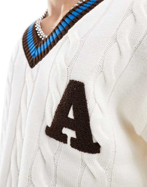 ASOS DESIGN relaxed cable knit varsity jumper in cream, 2 of 4