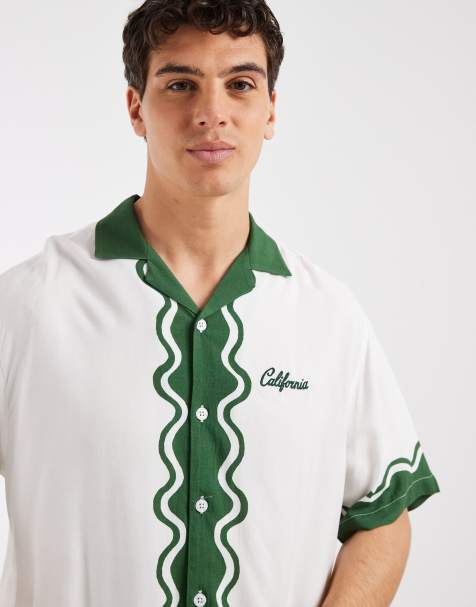 ASOS DESIGN relaxed camp collar shirt with chest and border print in off white - view 1
