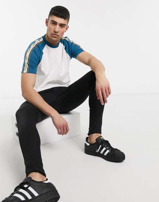 ASOS DESIGN relaxed contrast raglan T-shirt with original text print taping in cotton