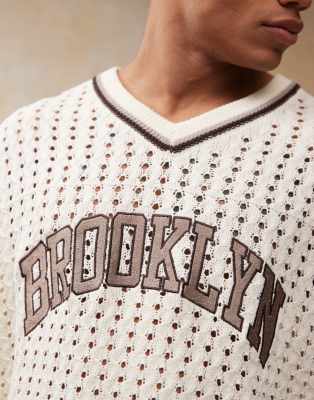 ASOS DESIGN RELAXED CROCHET KNIT T-SHIRT WITH VARSITY PATTERN AND CITY TEXT 