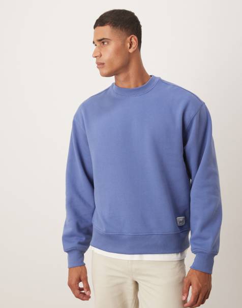 ASOS DESIGN relaxed drop shoulder sweatshirt with woven label detail in washed blue - view 1