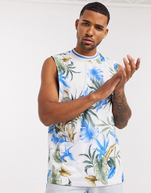 ASOS DESIGN relaxed dropped armhole sleeveless t-shirt with all over floral print and tipped neck rib
