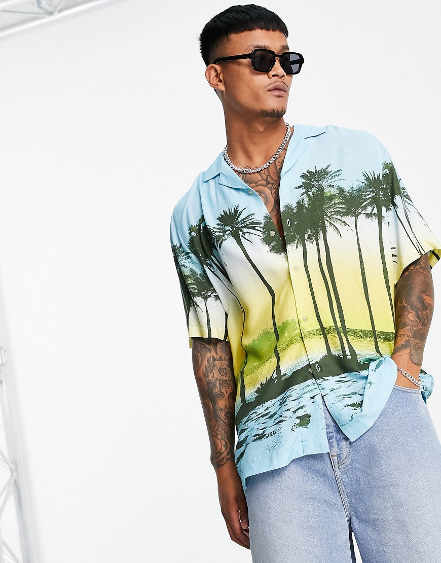ASOS DESIGN relaxed fit longline shirt in tropical scenic print-Yellow
