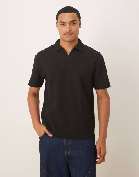 ASOS DESIGN – Relaxed Fit Polohemd in Schwarz mit Waffelstruktur - view 1