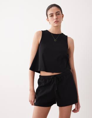 ASOS DESIGN - Relaxed-Fit-Shorts in Schwarz mit Kordelzug und Waffelstruktur, Kombiteil