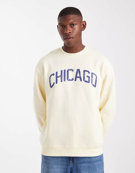 ASOS DESIGN – Relaxed-Fit-Sweatshirt in Blassgelb mit Schriftzug auf der Brust in abgenutzter Optik - view 1