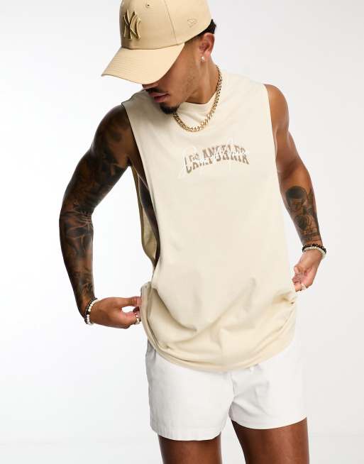 ASOS DESIGN relaxed fit tank top in beige with Los Angeles chest print