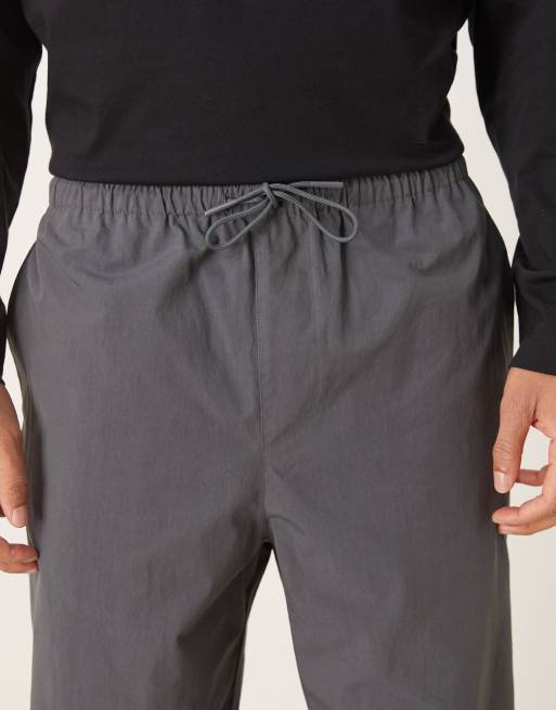 ASOS DESIGN relaxed fit tapered pants in charcoal nylon, 4 of 5