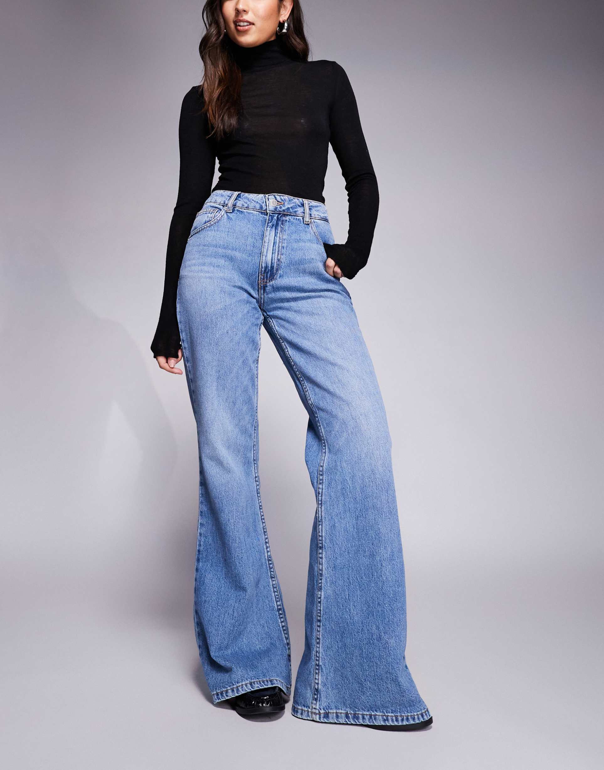 asos design relaxed flare jeans in mid blue