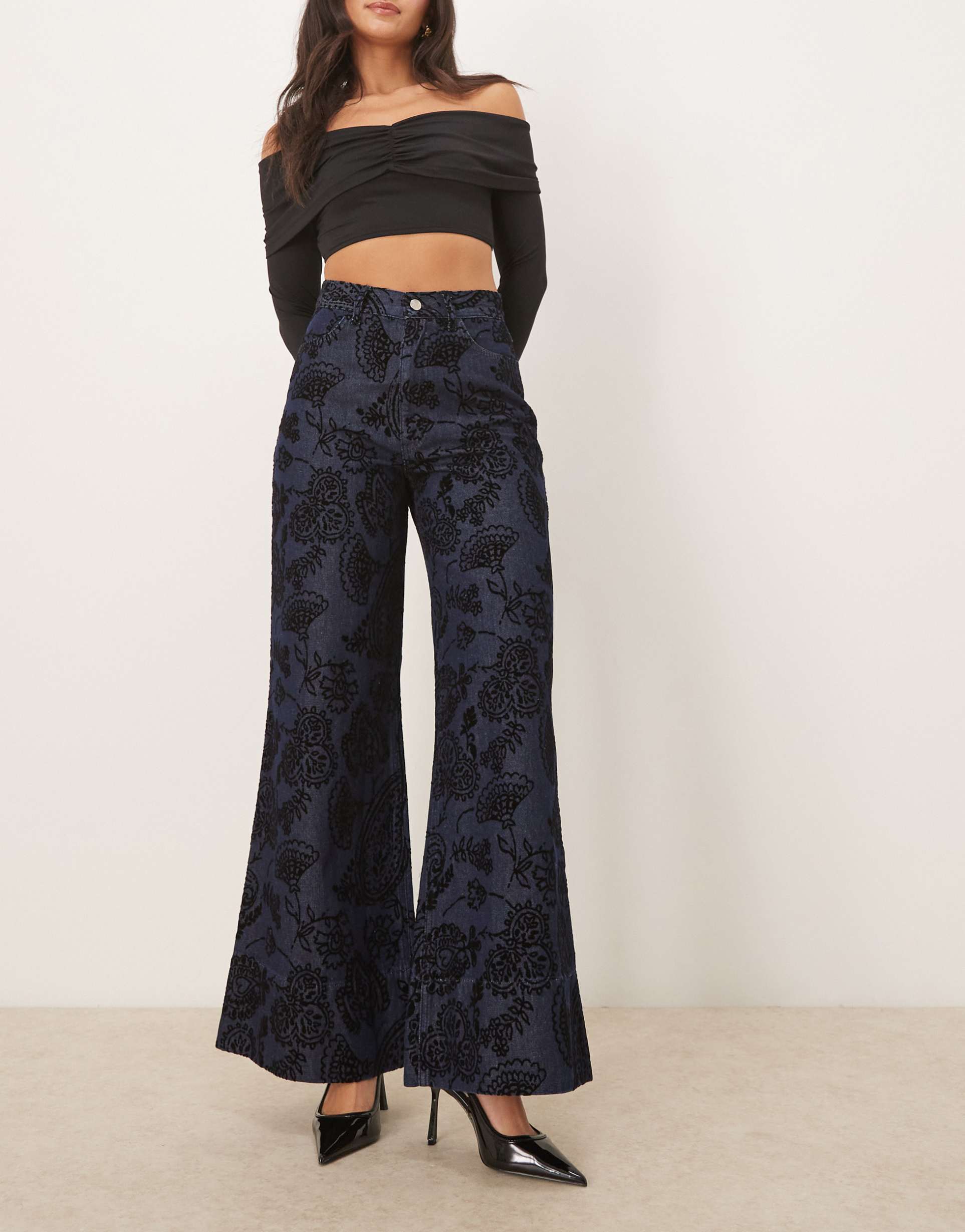 asos design relaxed flare jeans with paisley flock in mid blue
