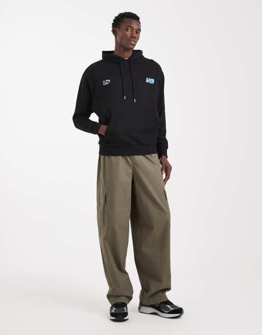 ASOS DESIGN relaxed hoodie with crackle racing print in black, 2 of 5