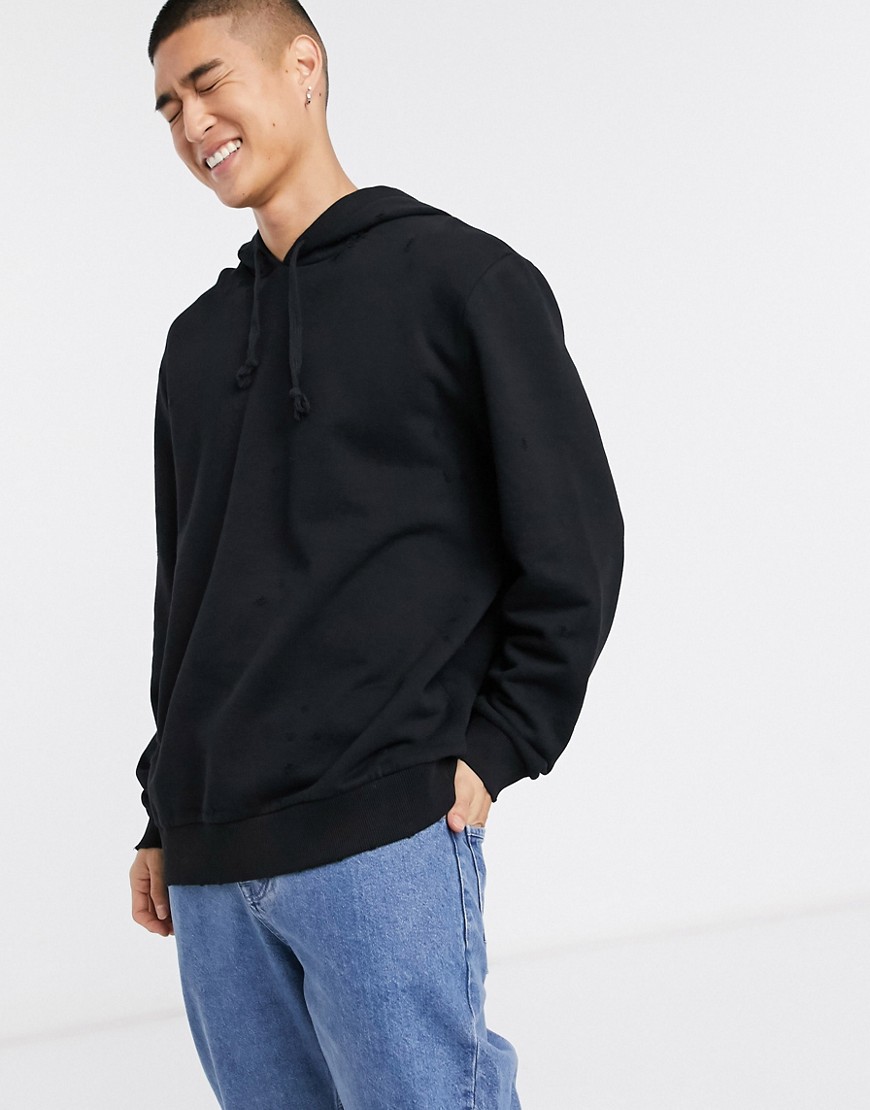 ASOS DESIGN relaxed hoodie with distressing in black
