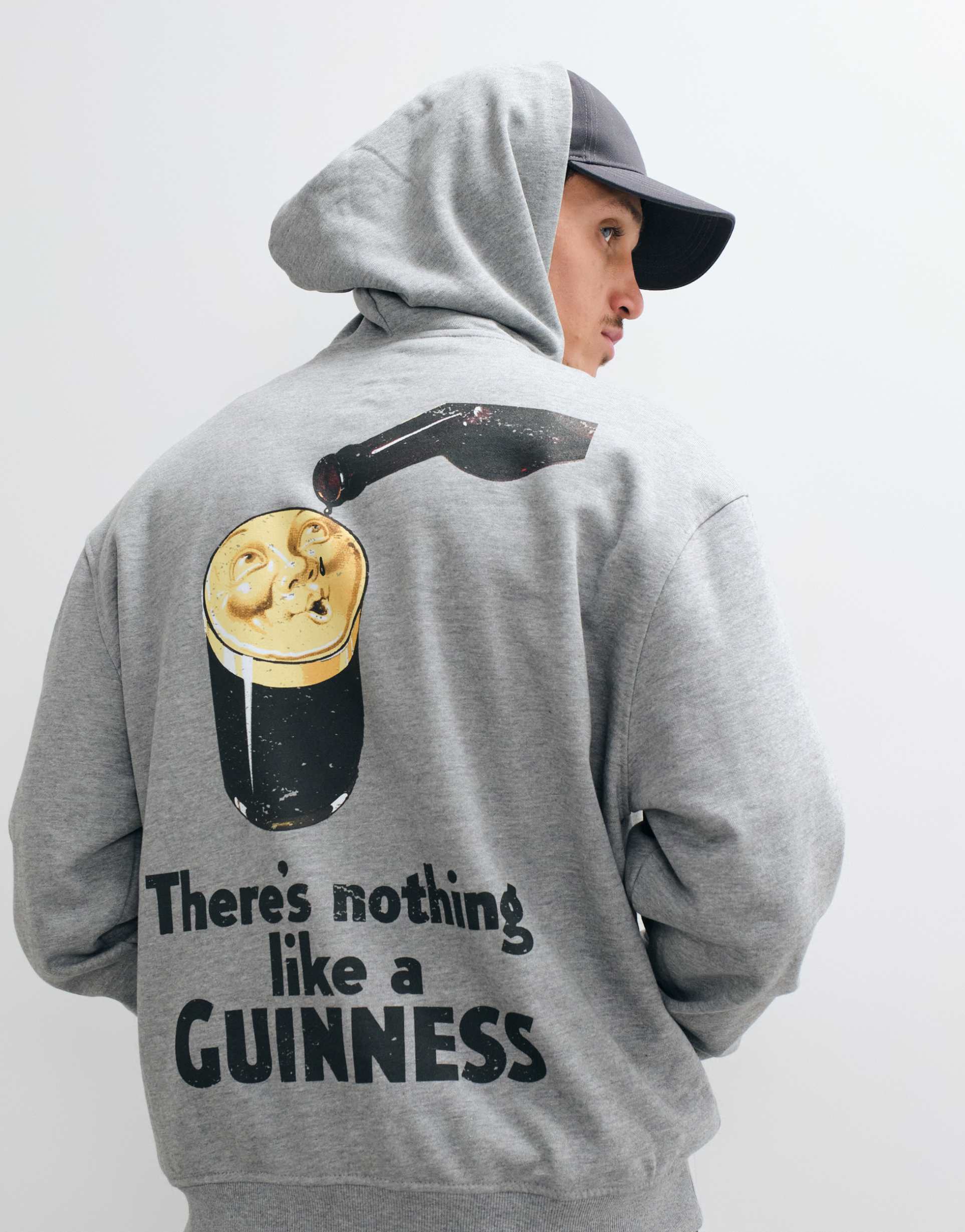ASOS DESIGN relaxed hoodie with Guinness print in Grey Marl