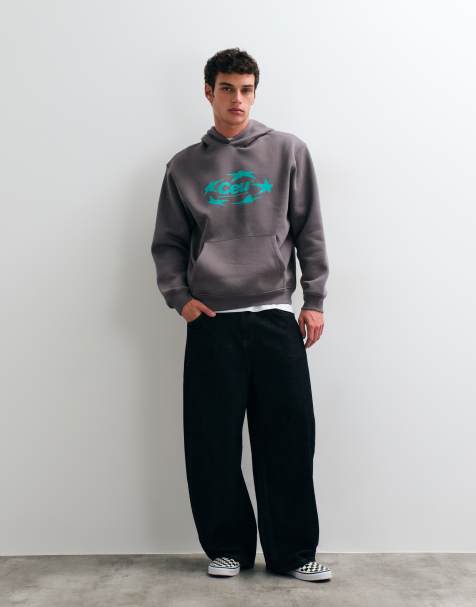 ASOS DESIGN relaxed hoodie with star graphic print in dark grey - view 1
