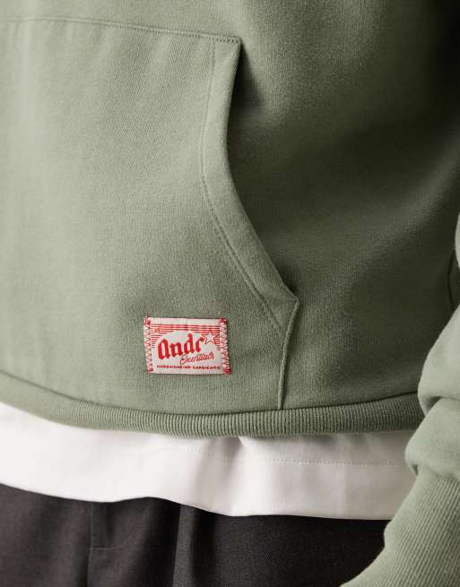 ASOS DESIGN relaxed hoodie with woven label detail in washed green, 5 of 5