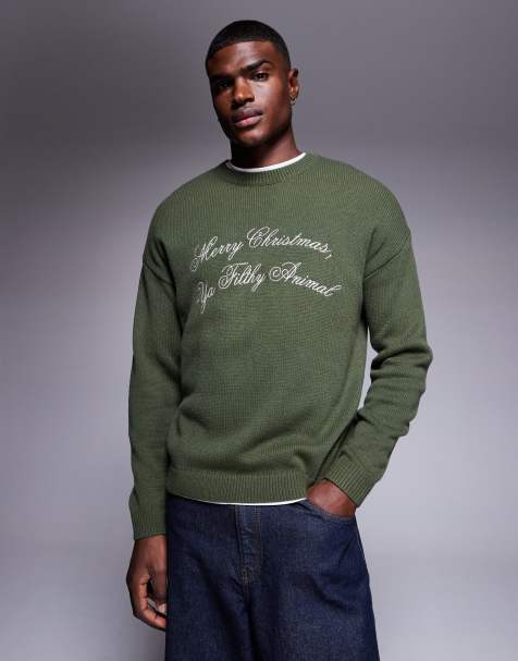ASOS DESIGN relaxed knit sweater with Merry Christmas Ya Filthy Animal slogan in green - view 1