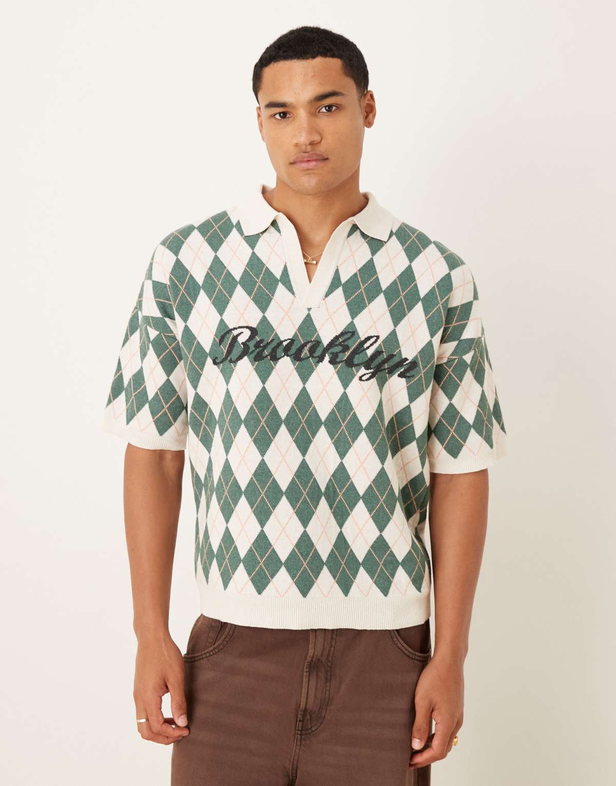 ASOS DESIGN relaxed knitted argyle print polo with Brooklyn graphic in cream and green