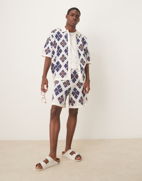 ASOS DESIGN relaxed knitted button through polo and shorts co-ord with aztec pattern in blue - view 1