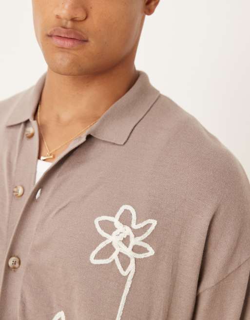 ASOS DESIGN relaxed knitted button-through polo shirt with floral pattern in brown