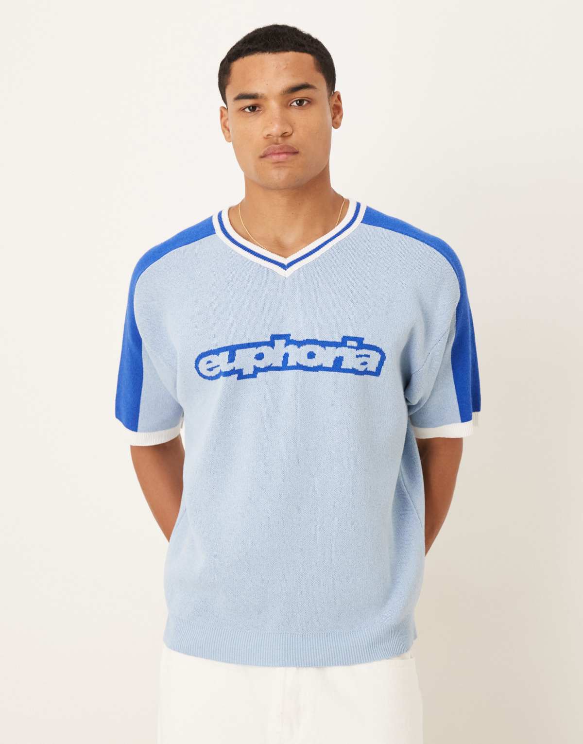 ASOS DESIGN relaxed knitted v-neck t-shirt with Euphoria graphic in light blue