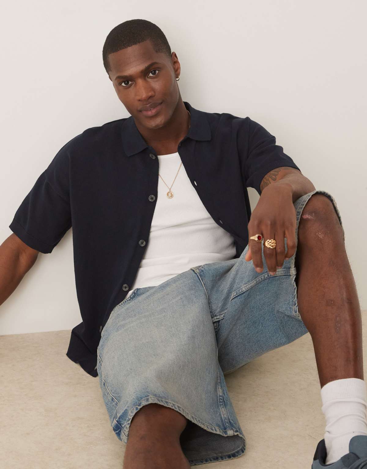 ASOS DESIGN relaxed lightweight knitted cotton button through polo in navy