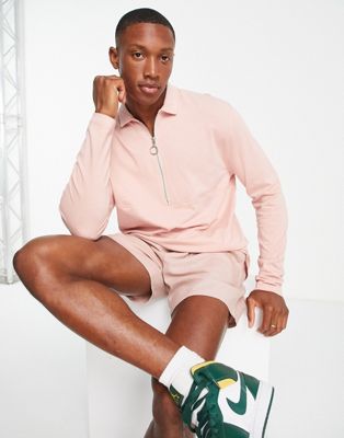 ASOS DESIGN relaxed long sleeve polo t-shirt with ring pull zip in pink