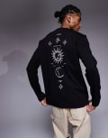 [ASOS DESIGN] ASOS DESIGN relaxed long sleeve t-shirt with celestial spine graphic in black S BLACK