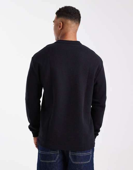 ASOS DESIGN relaxed long sleeve T-shirt with henley neck in black waffle