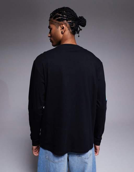 ASOS DESIGN relaxed long sleeve t-shirt with ski sports graphic in black, 3 of 5