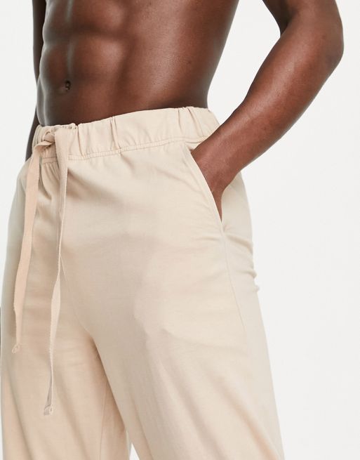 ASOS DESIGN relaxed lounge pants in beige with drawstring