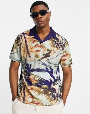 ASOS DESIGN relaxed polo t-shirt with all over scenic print