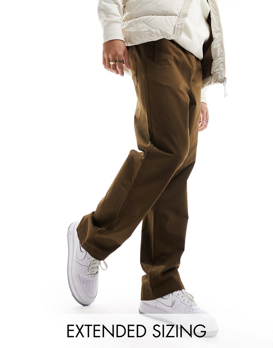 Shop Asos Design Relaxed Pull-on Pants In Brown With Elasticized Waist