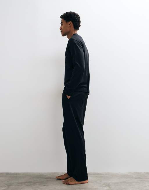 ASOS DESIGN relaxed pyjama set with long sleeve henley in black, 2 of 5