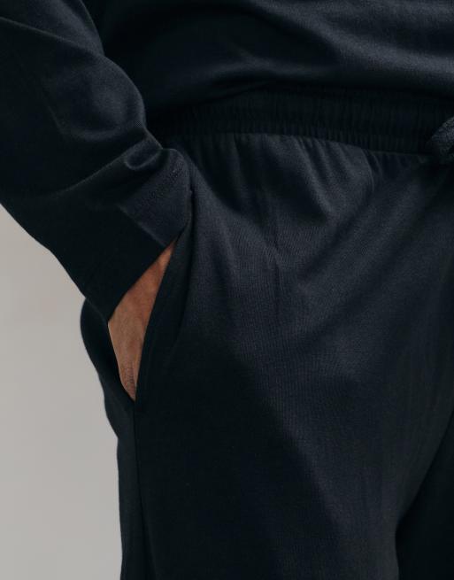 ASOS DESIGN relaxed pyjama set with long sleeve henley in black, 5 of 5