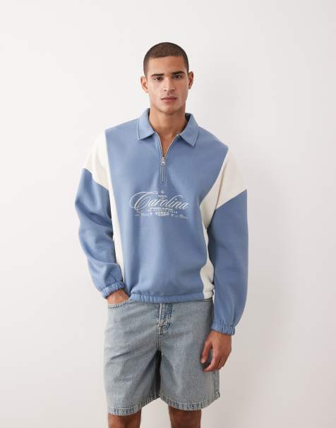 ASOS DESIGN relaxed quarter zip sweatshirt with cut & sew panels and embroidered print in blue - view 1