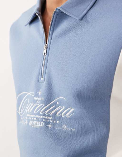 ASOS DESIGN relaxed quarter zip with cut & sew panels and embroidered print in blue, 2 of 5